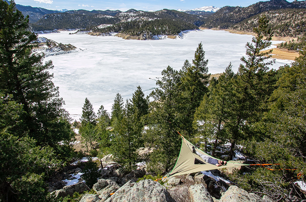 camping hammock above frozen lake (4355007676489)