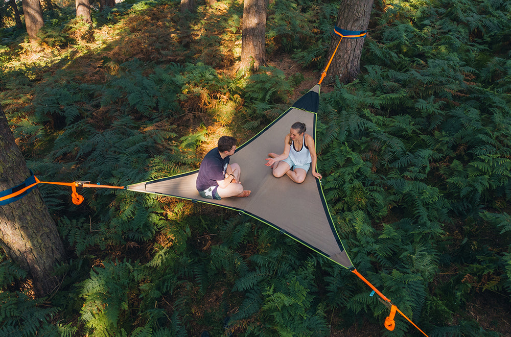 man and woman in camping hammock (6649461112905)