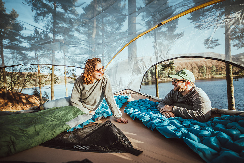 man and woman camping in tree tent (4354238382153)