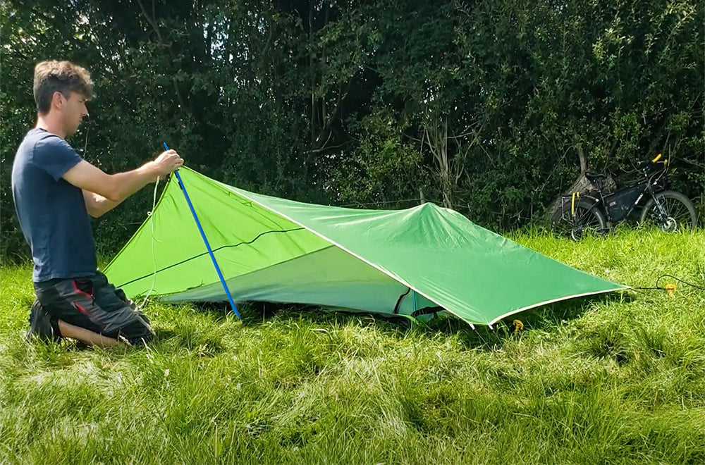 man setting up tent (4360224637001)