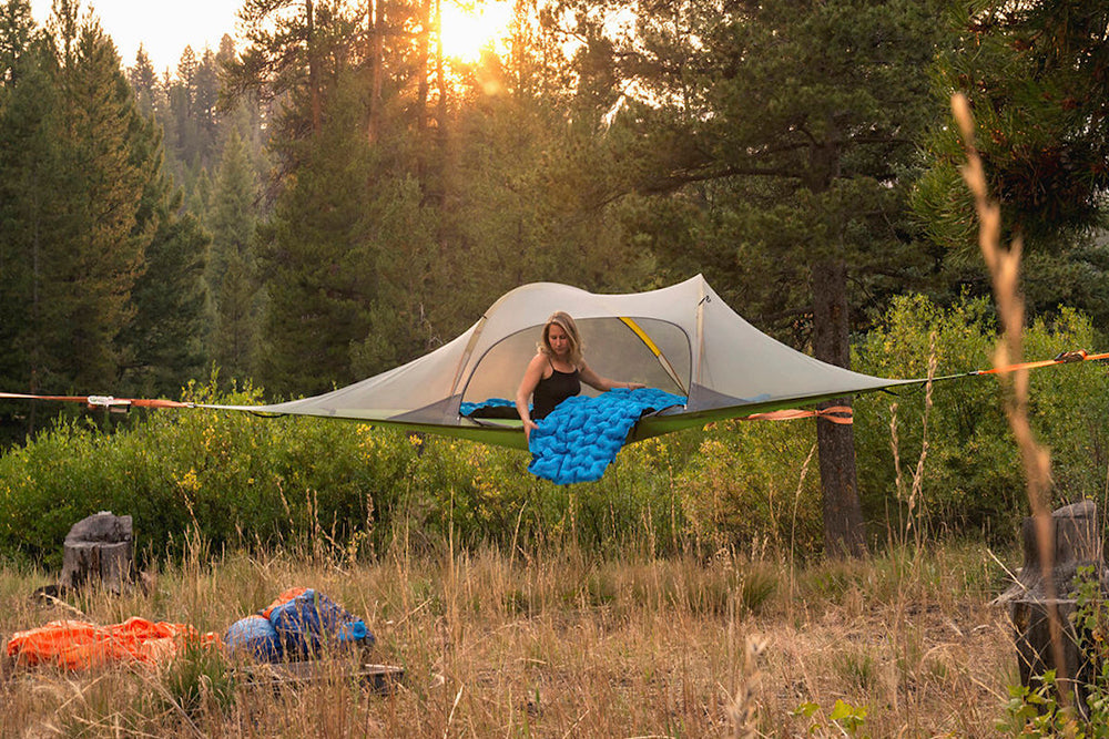 woman in tree tent with sky-pad (6228530372)