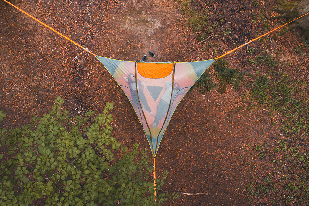 Aerial shot of couple in tree tent (6835887636553)