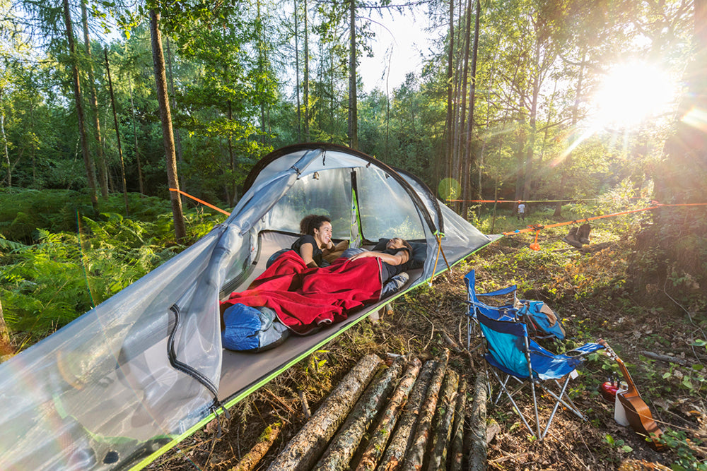 women laid in tree tent (4354219573321)