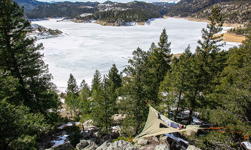 camping hammock above frozen lake (4355007676489)