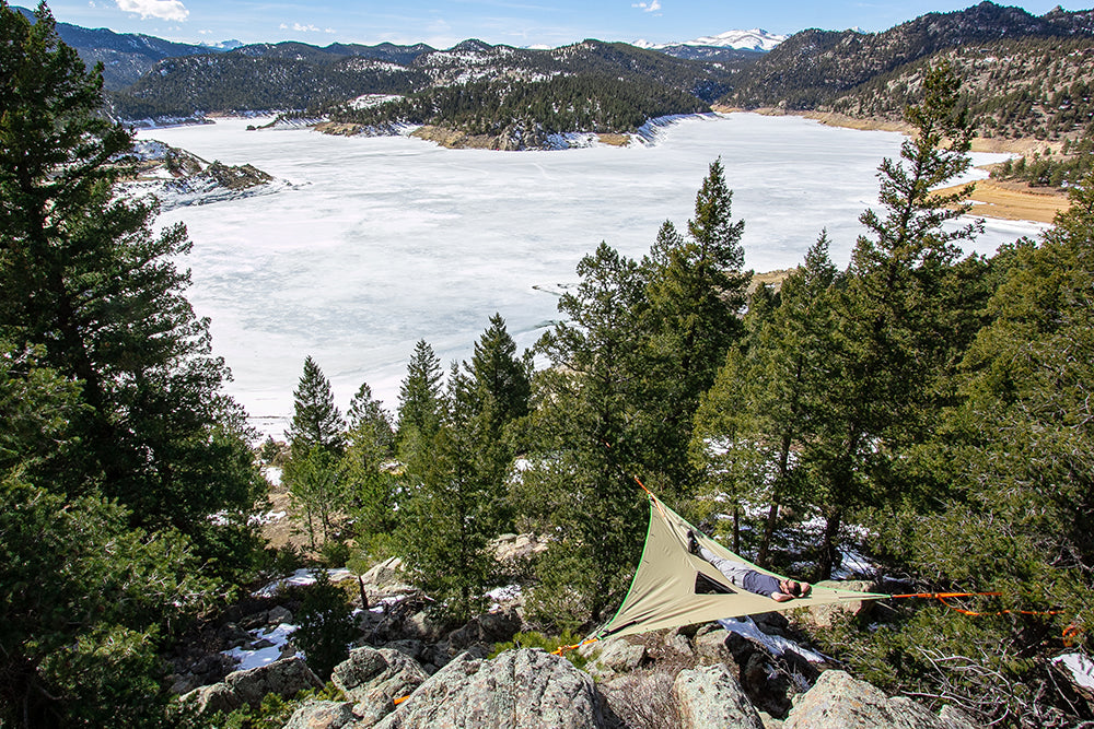 camping hammock above frozen lake (4355007676489)
