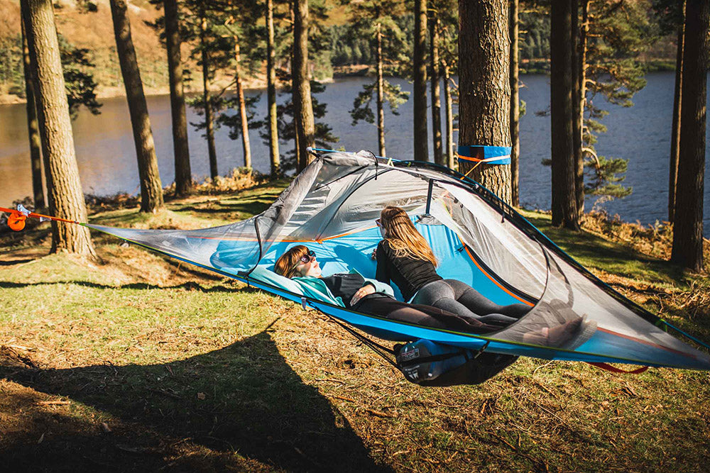 women laid in tree tent (4351223234633)