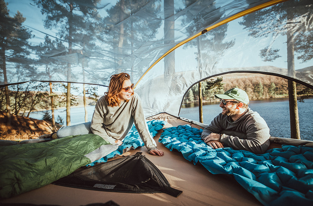 man and woman camping in tree tent (4354238382153)