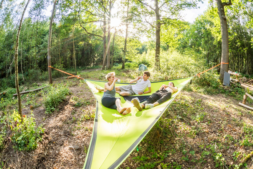 friends sat in camping hammock (4355006038089)