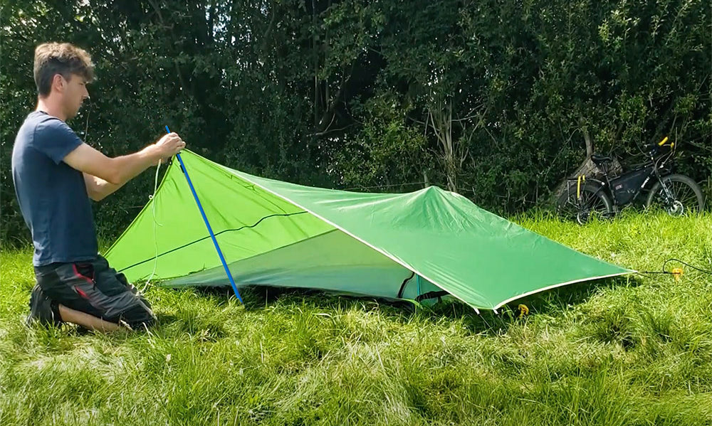 man setting up tent (4360224637001)