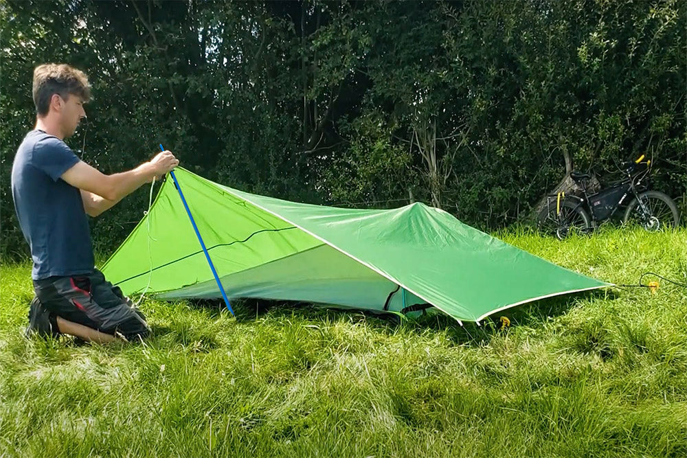 man setting up tent (4360224637001)